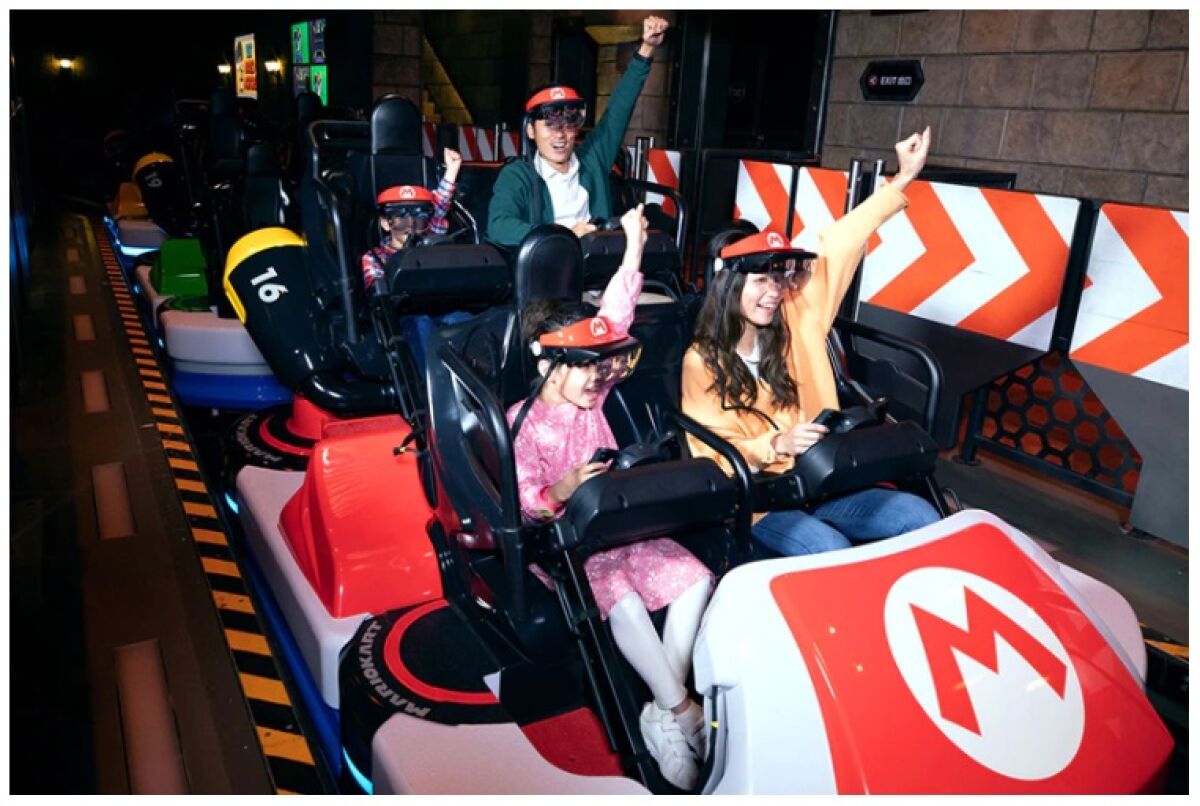 Guests on a "Mario Kart"-inspired ride at Universal Studios Japan, which utilizes augmented reality techniques.