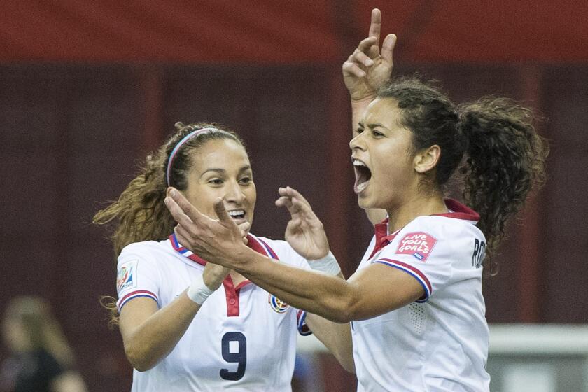 Costa Rica midfielder Raquel Rodriguez Cedeno, right, celebrates with forward Carolina Venegas (9) after scoring on Spain during the first half of the teams' Women's World Cup opener on Tuesday.