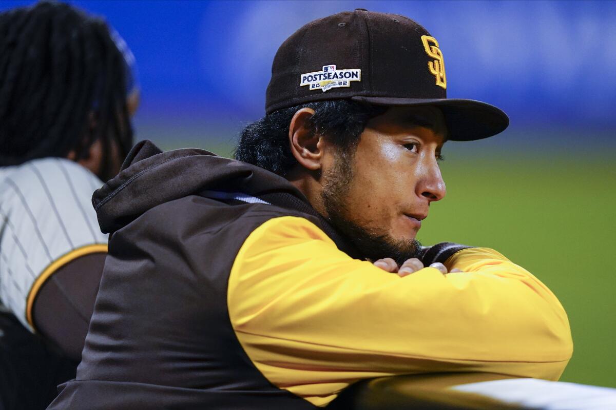 San Diego pitcher Yu Darvish watches from the dugout during Game 2 vs. the Mets.