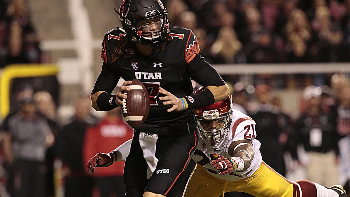 USC's Su'a Cravens sacks Utah quarterback Travis Wilson earlier this season at Rice-Eccles Stadium.