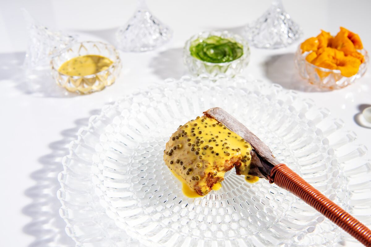 Tuna katsu is draped in saffron-caviar sauce tableside.