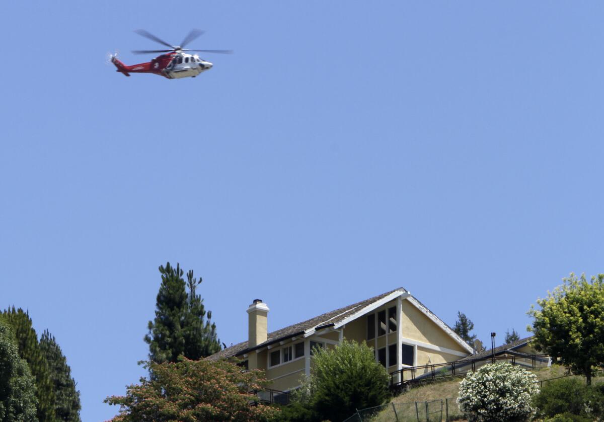 A helicopter flies near the 405 Freeway during the weekend-long road closure in 2011 known as Carmageddon, when helicopters carrying media, tourists and other curiosity seekers hovered for hours over the site.