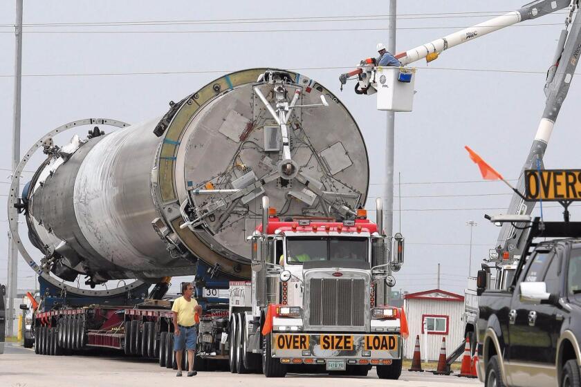 SpaceX moves the first stage of a Falcon 9 rocket from Port Canaveral in Florida on June 6.