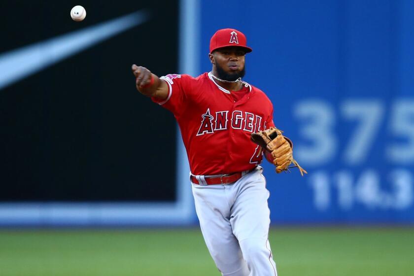 TORONTO, ON - JUNE 18: Luis Rengifo #4 of the Los Angeles Angels of Anaheim throws to first to get Freddy Galvis of the Toronto Blue Jays out in the third inning during a MLB game at Rogers Centre on June 18, 2019 in Toronto, Canada. (Photo by Vaughn Ridley/Getty Images) ** OUTS - ELSENT, FPG, CM - OUTS * NM, PH, VA if sourced by CT, LA or MoD **