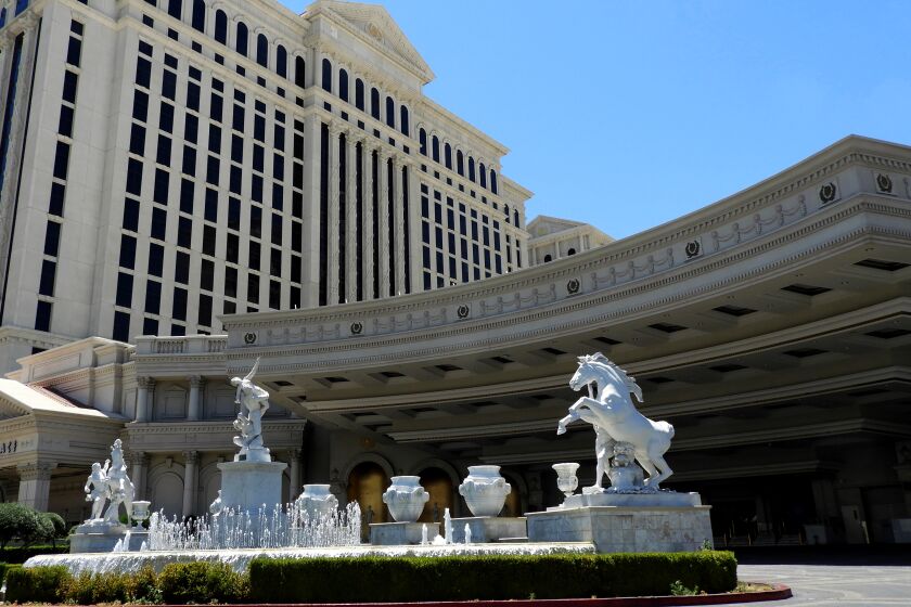 The main entrance to Caesars Palace in Las Vegas, devoid of the usual taxis and other vehicles, is seen May 16 during the state-ordered shutdown of Nevada. Traffic is expected to resume, at least to some degree, when the resort reopens on June 4.