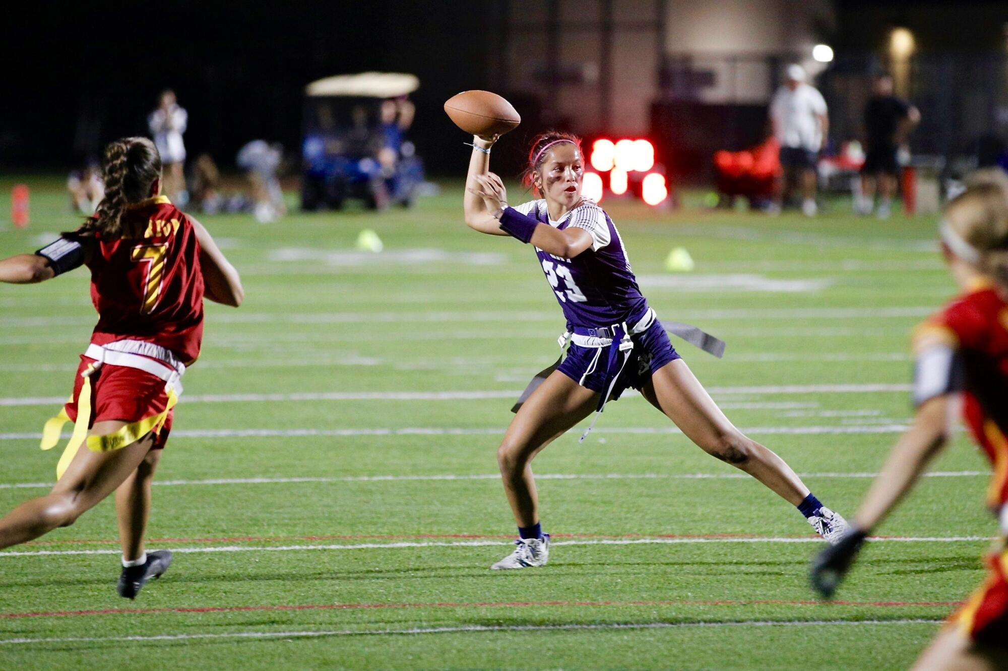 Newport Harbor quarterback Maia Helmar prepares to pass during a game.