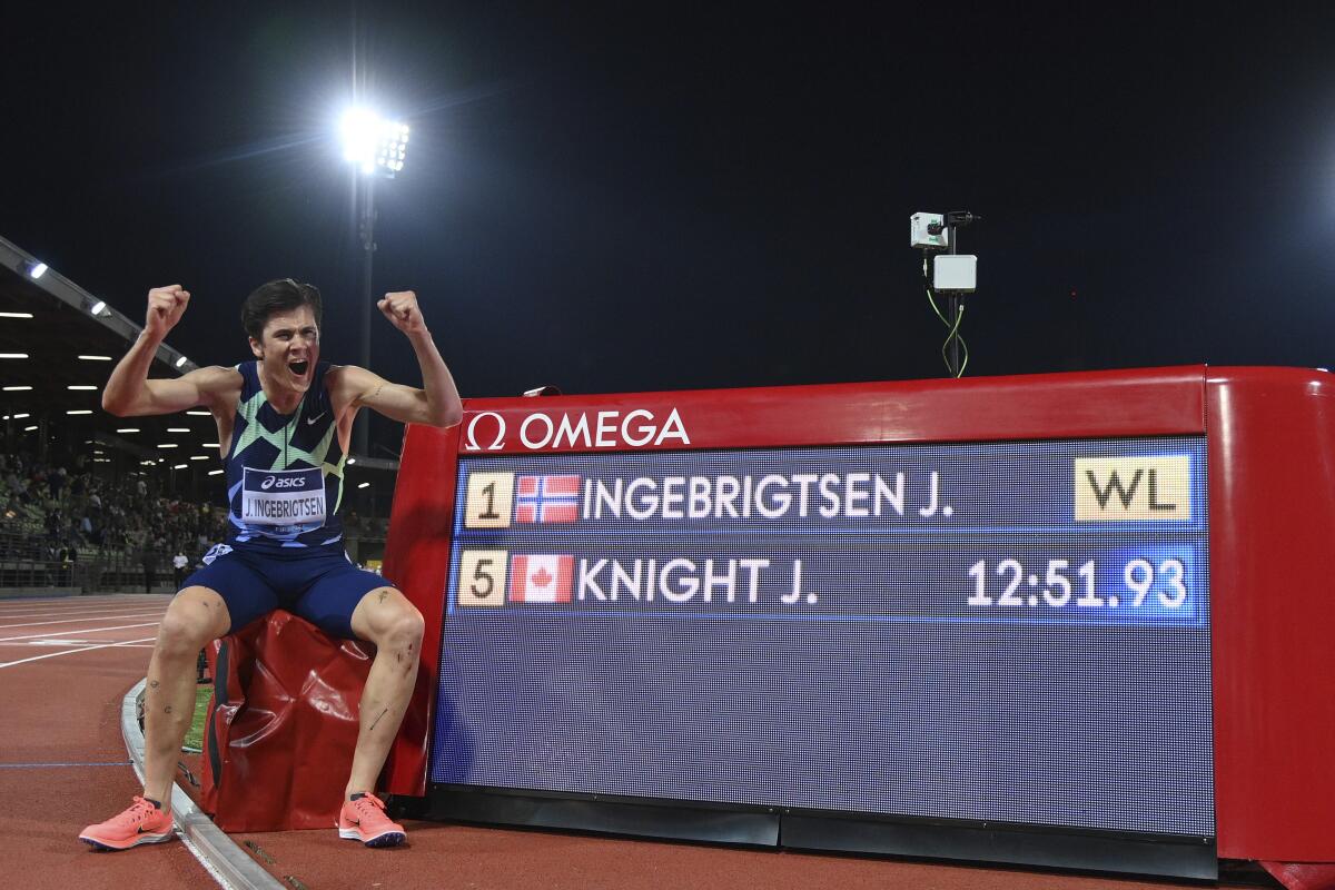 Norway's Jakob Ingebrigtsen celebrates winning the men's 5000 meters event at the Diamond League track and field meeting in Florence, Italy, Thursday, June 10, 2021. (Alfredo Falcone/LaPresse via AP)