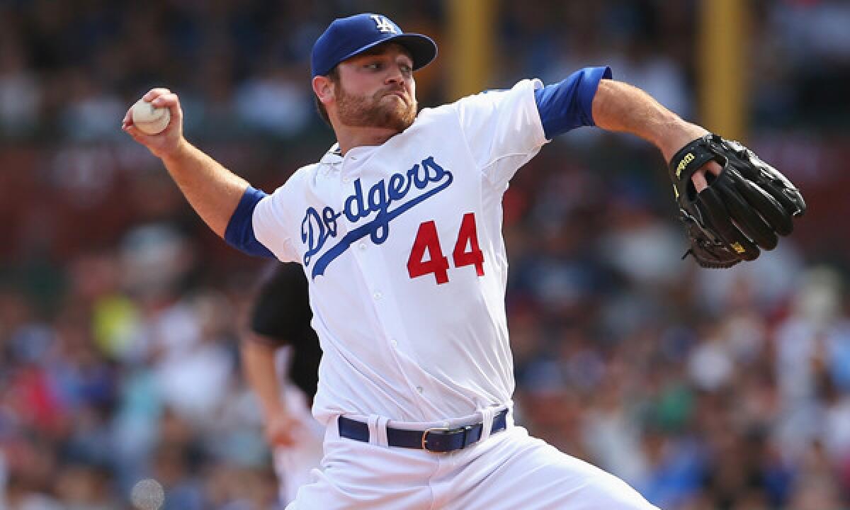 Dodgers reliever Chris Withrow delivers a pitch during a win over the Arizona Diamondbacks in Australia. Withrow is in danger of losing his spot on the roster once Brian Wilson returns from the disabled list.