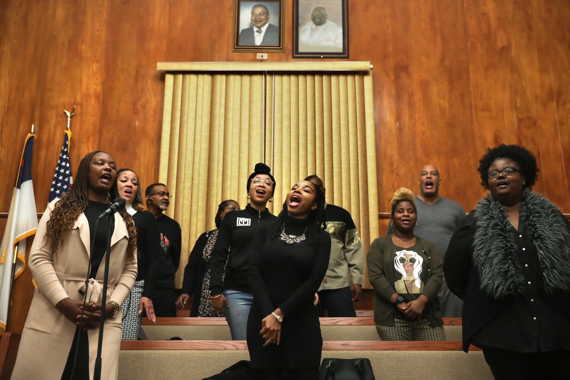 Choir members sing during a rehearsal at Greater New Unity Baptist Church.