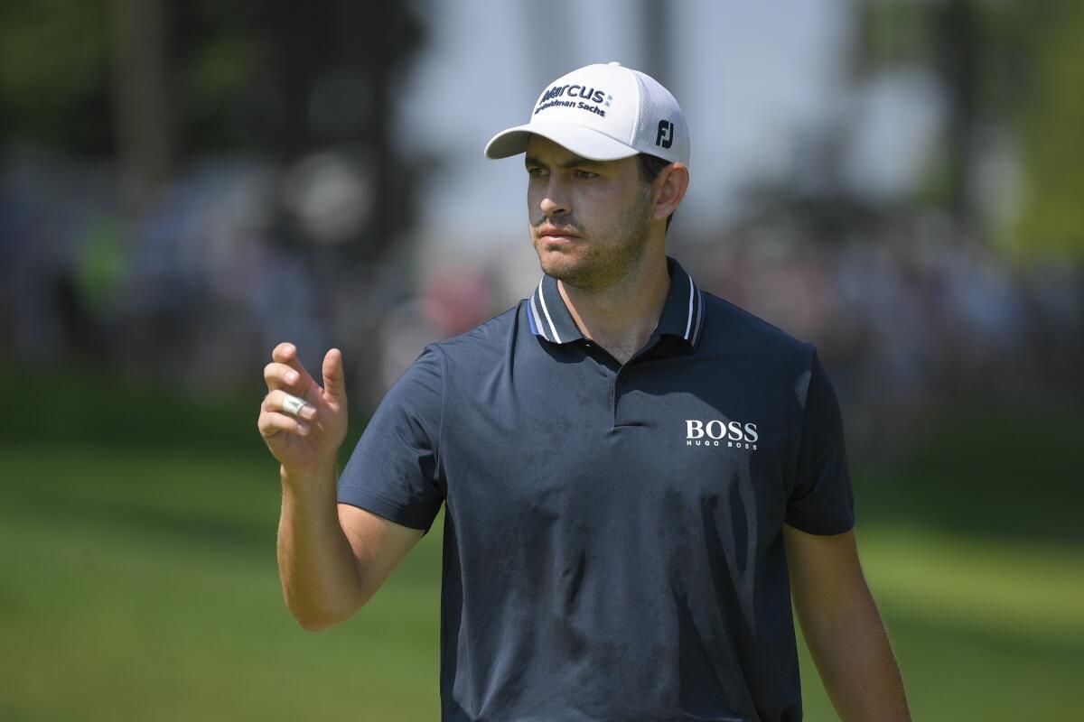 Patrick Cantlay reacts after putting on the first green during the second round of the BMW Championship on Aug. 27, 2021.