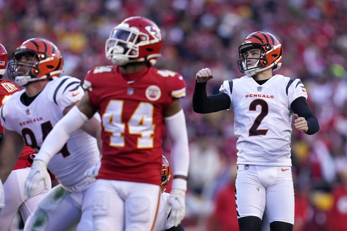 Cincinnati Bengals kicker Evan McPherson, right, kicks a 31-yard field goal.