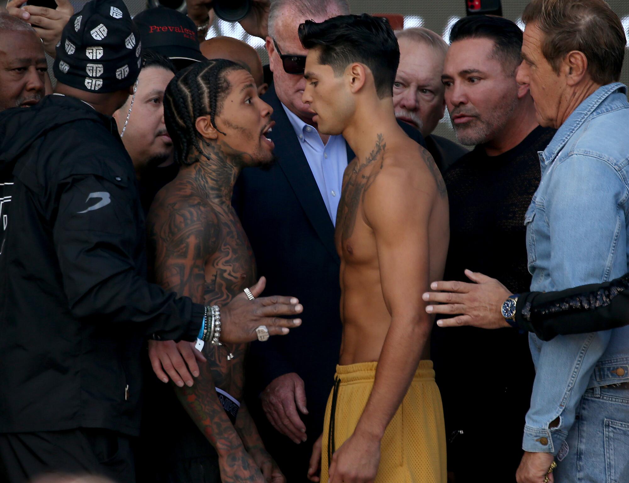 Boxers Gervonta Davis and Ryan Garcia face off after weighing in for their long-anticipated fight 