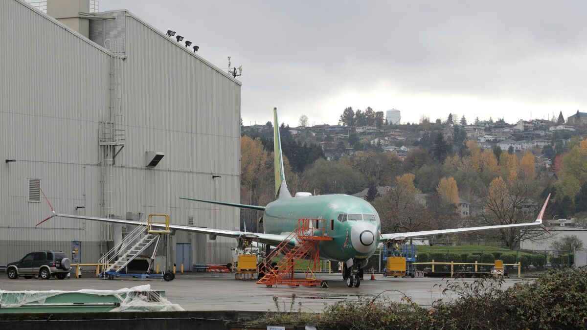 A Boeing 737-MAX 8 is parked outside Boeing Co.'s 737 assembly facility in Renton, Wash. Lion Air's founder told Bloomberg that he is considering canceling the Indonesian airline's orders of the 737 aircraft.