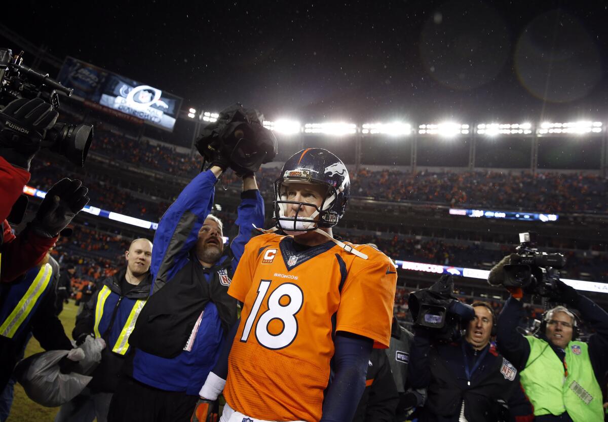 Denver quarterback Peyton Manning leaves the field after the Broncos' loss to the Indianapolis Colts.