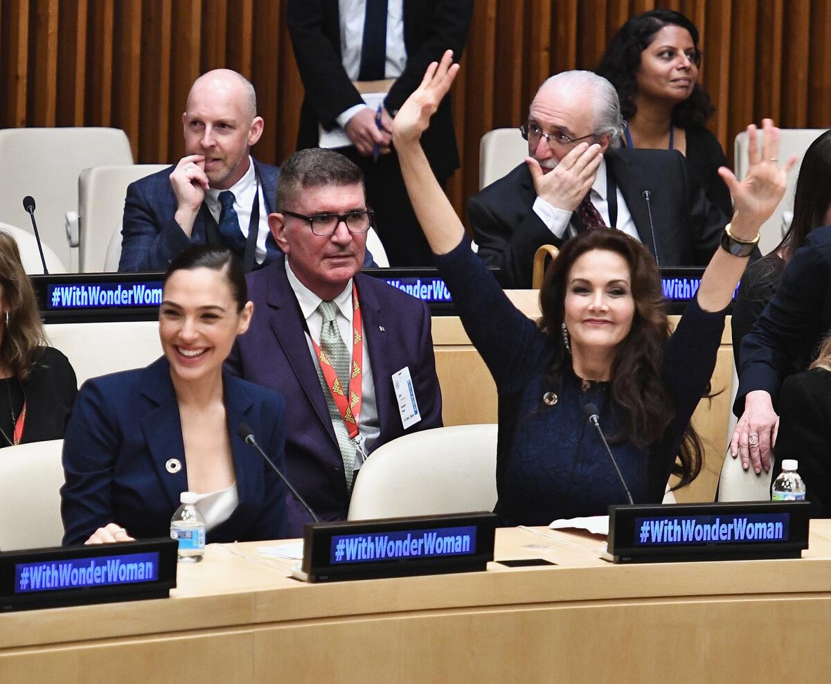 Wonder Woman in the upcoming self-titled film, Gal Gadot, and Wonder Woman in the 1970s hit TV show, Lynda Carter, celebrate as the character is recognized by the United Nations.