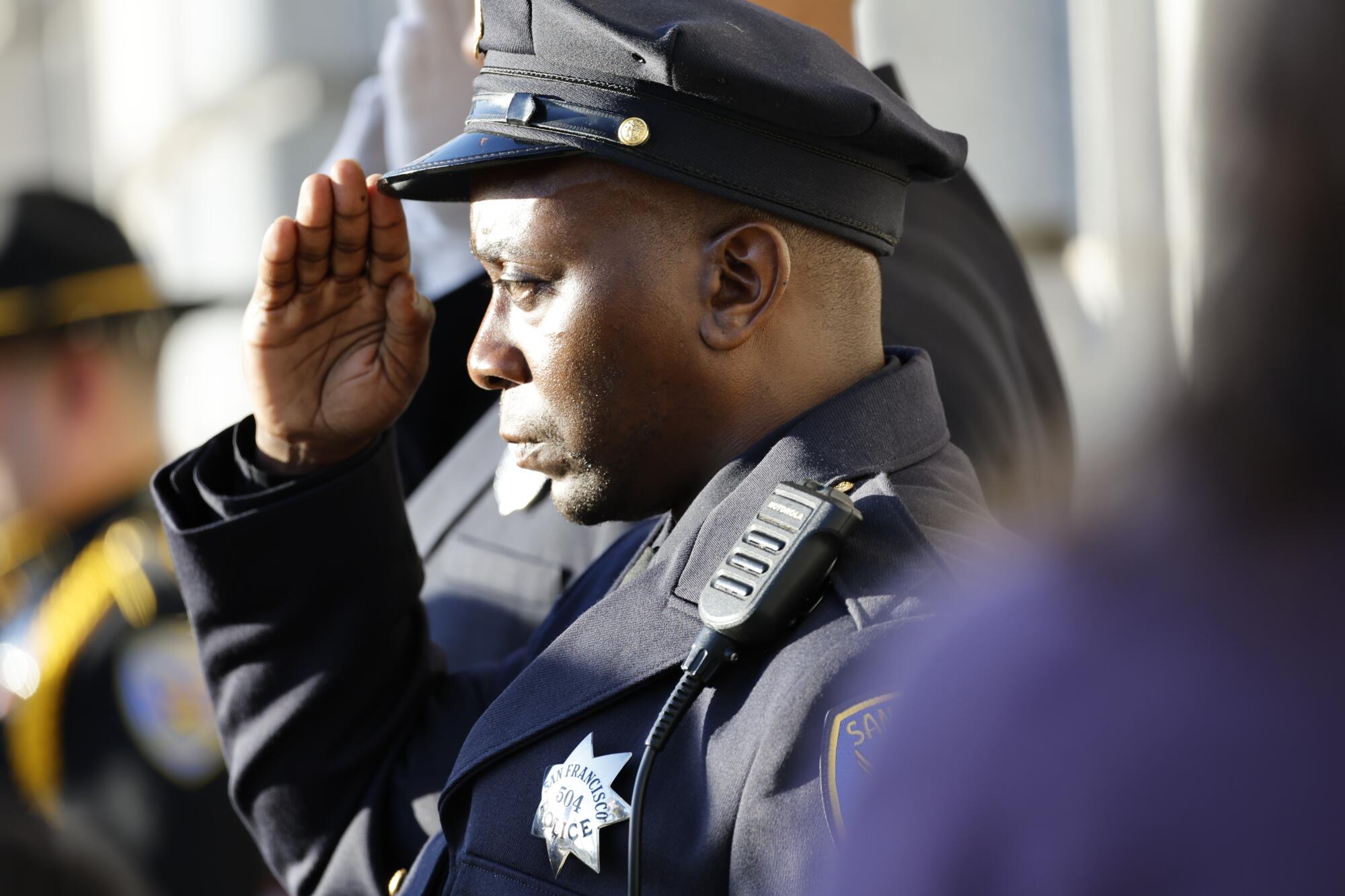 A police officer salutes.