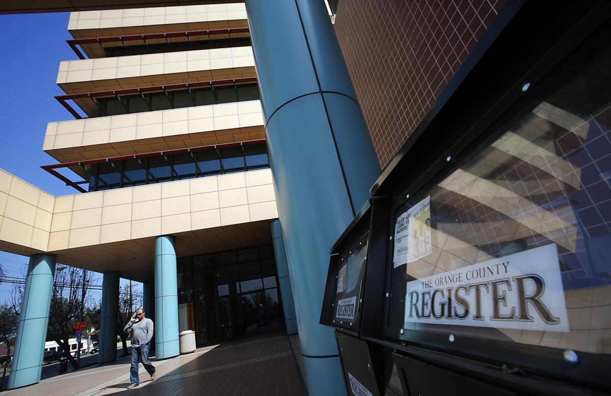 Freedom Communications Inc. is showing signs of financial distress. The parent company of the Orange County Register, whose headquarters are shown, is expected to announce layoffs Monday.