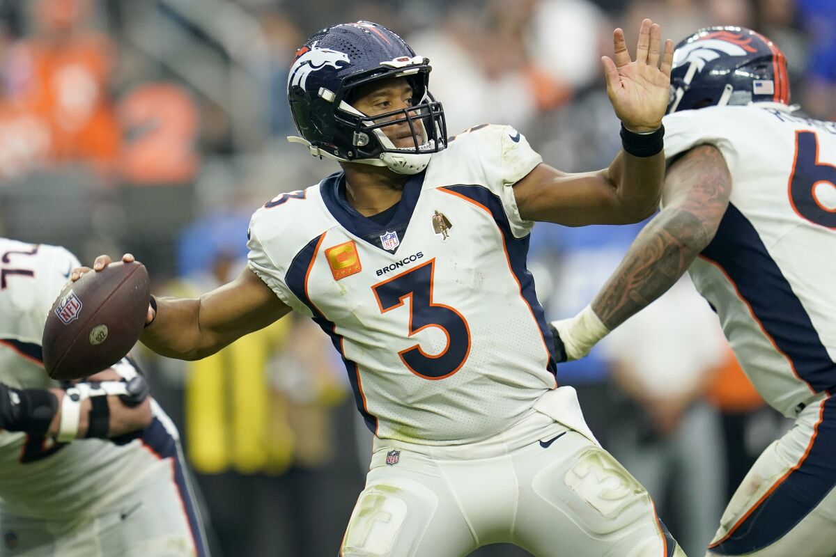 Denver Broncos quarterback Russell Wilson (3) throws against the Las Vegas Raiders during the second half of an NFL football game, Sunday, Oct. 2, 2022, in Las Vegas. (AP Photo/Abbie Parr)