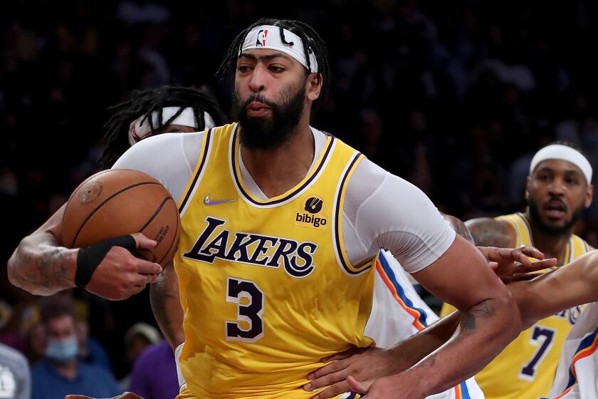 Lakers big man Anthony Davis pulls down a defensive rebound 