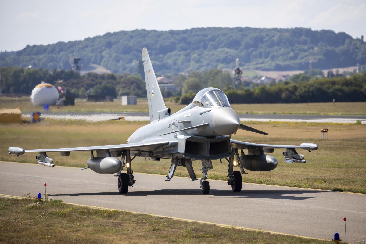 A German Eurofighter gets ready for takeoff at Neuburg Air Base in Neuburg An Der Donau, Germany, Monday Aug. 15, 2022. A group of German air force fighter jets neared Singapore on Tuesday, Aug. 16, 2022, in a marathon bid to fly them some 12,800 kilometers (8,000 miles) from their home base to Southeast Asia in just 24 hours. (Daniel Karmann/dpa via AP)