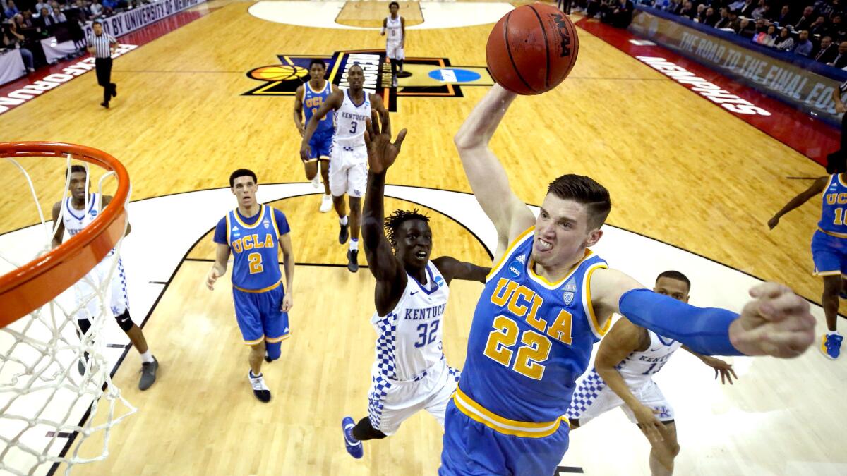 UCLA forward TJ Leaf takes off for a dunk against Kentucky during the first half Friday.