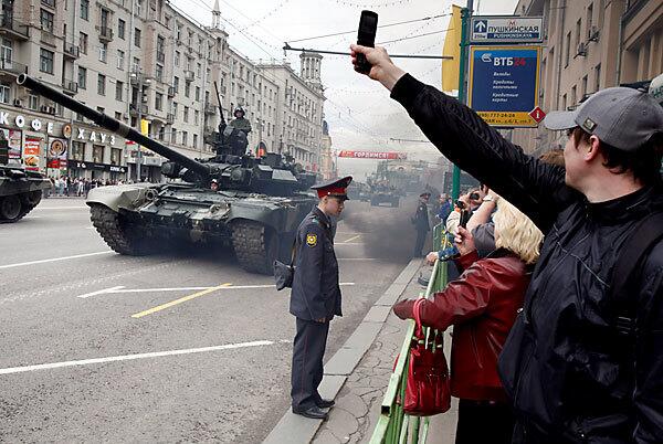 On Tverskaya Street in downtown Moscow, tanks roll by during a dress rehearsal for the Victory Day parade.