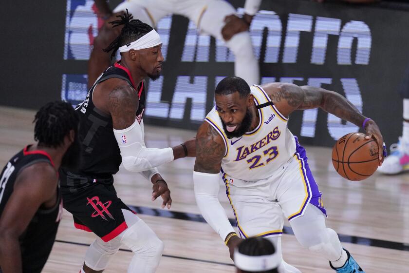 Los Angeles Lakers' LeBron James (23) drives to the basket against the Houston Rockets during the first half of an NBA conference semifinal playoff basketball game Saturday, Sept. 12, 2020, in Lake Buena Vista, Fla. (AP Photo/Mark J. Terrill)
