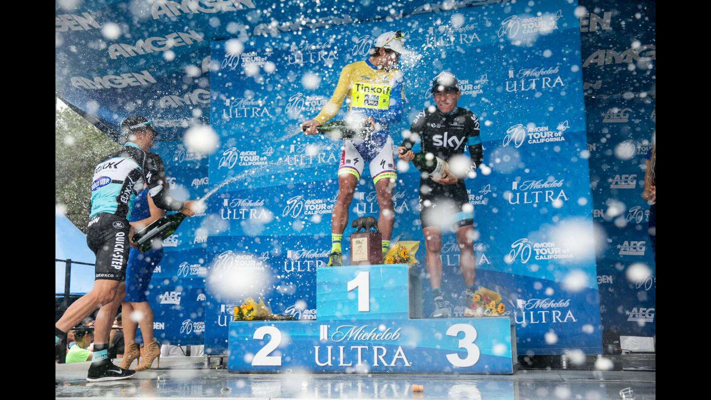 Julian Alaphilippe, of Team Etixx-Quick-Step, from left, Peter Sagan, of team Tinkoff-Saxo, and Sergio Luis Henao Montoya of Team Sky, take aim as they celebrate after their victory in the Amgen Tour of California in Pasadena.