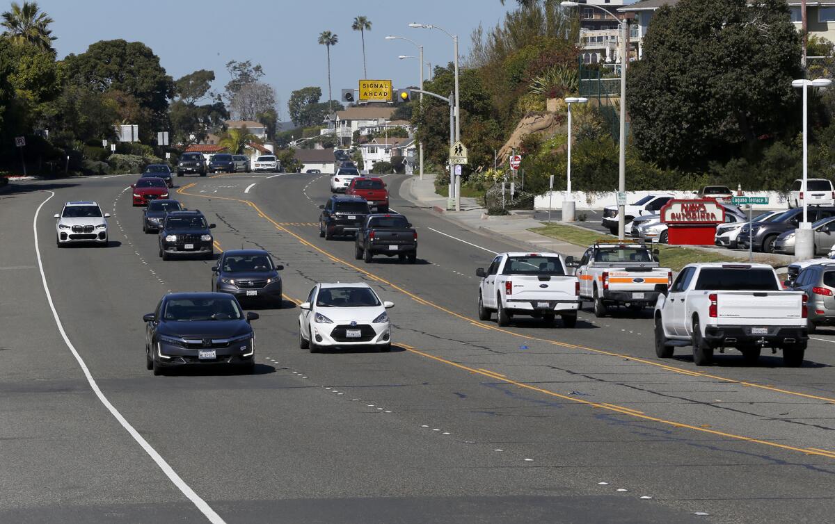 Cars roll down South Coast Highway in Laguna Beach.