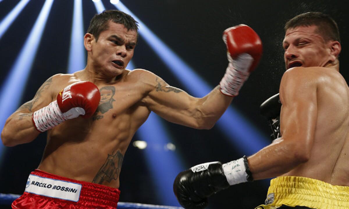 Marcos Maidana, left, throws a punch at Jesus Soto-Karass during their welterweight fight in Las Vegas in September 2012. Maidana won the bout.