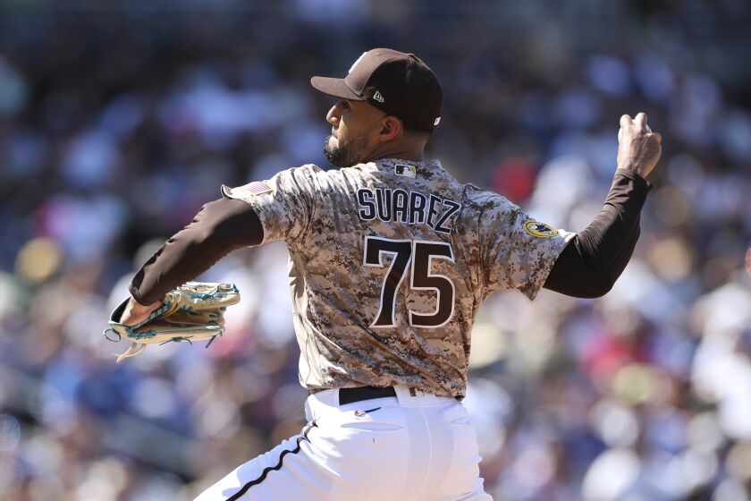 San Diego Padres relief pitcher Robert Suarez works against the Los Angeles Dodgers in a baseball game Sunday, Sept. 11, 2022, in San Diego. (AP Photo/Derrick Tuskan)
