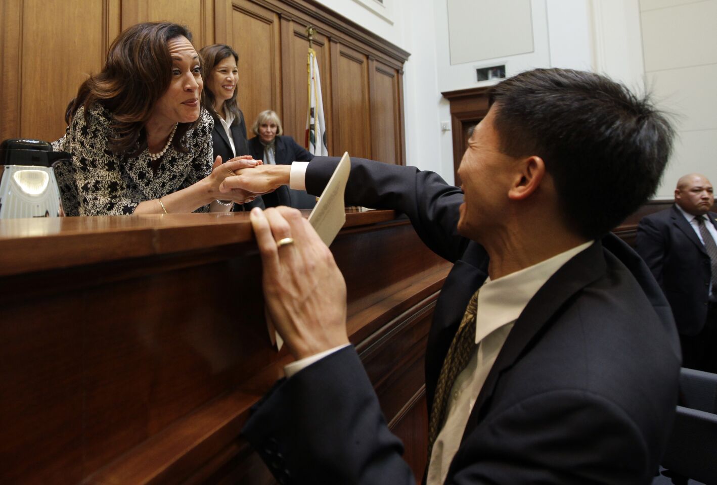 Aug. 31, 2011: UC Berkeley law professor Goodwin Liu shakes hands with Kamala Harris.