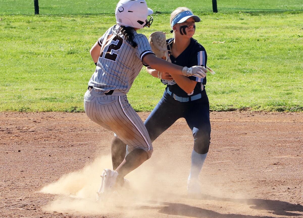 Marina's Courtney Hames (3) tags St. Francis' Rebecca Quinn (12) at second in the Michelle Carew Classic on Saturday.