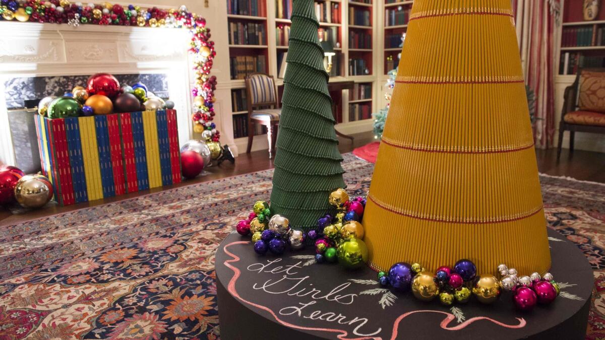 In the Library, crayons and pencils were used to form stylized trees while ornaments spell out the word “girls” in 12 languages,