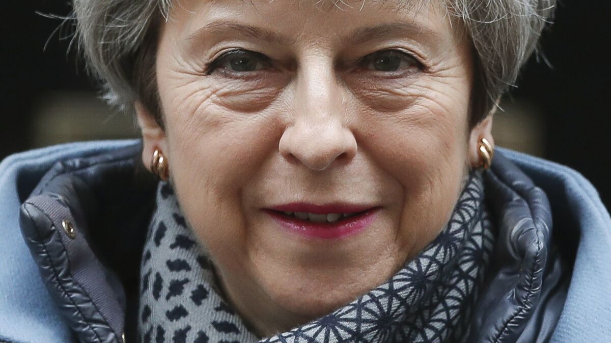 British Prime Minister Theresa May leaves 10 Downing St. to take questions at the House of Commons in London on March 27, 2019.