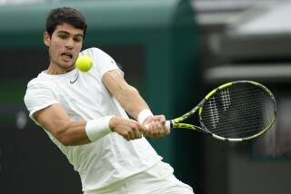 Spain's Carlos Alcaraz returns to Jeremy Chardy of France in a first round men's singles match on day two of the Wimbledon tennis championships in London, Tuesday, July 4, 2023. (AP Photo/Kirsty Wigglesworth)
