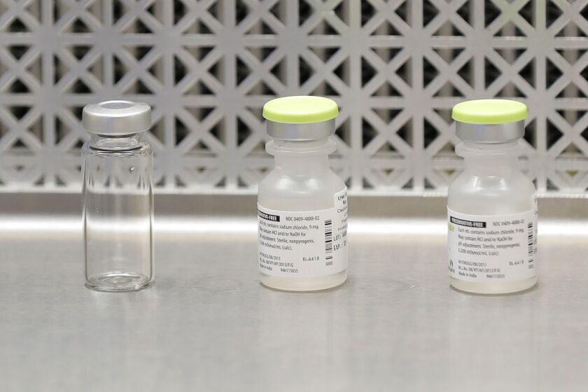 Vials used to prepare syringes in a safety study of a potential coronavirus vaccine developed by the National Institutes of Health and Moderna Inc.