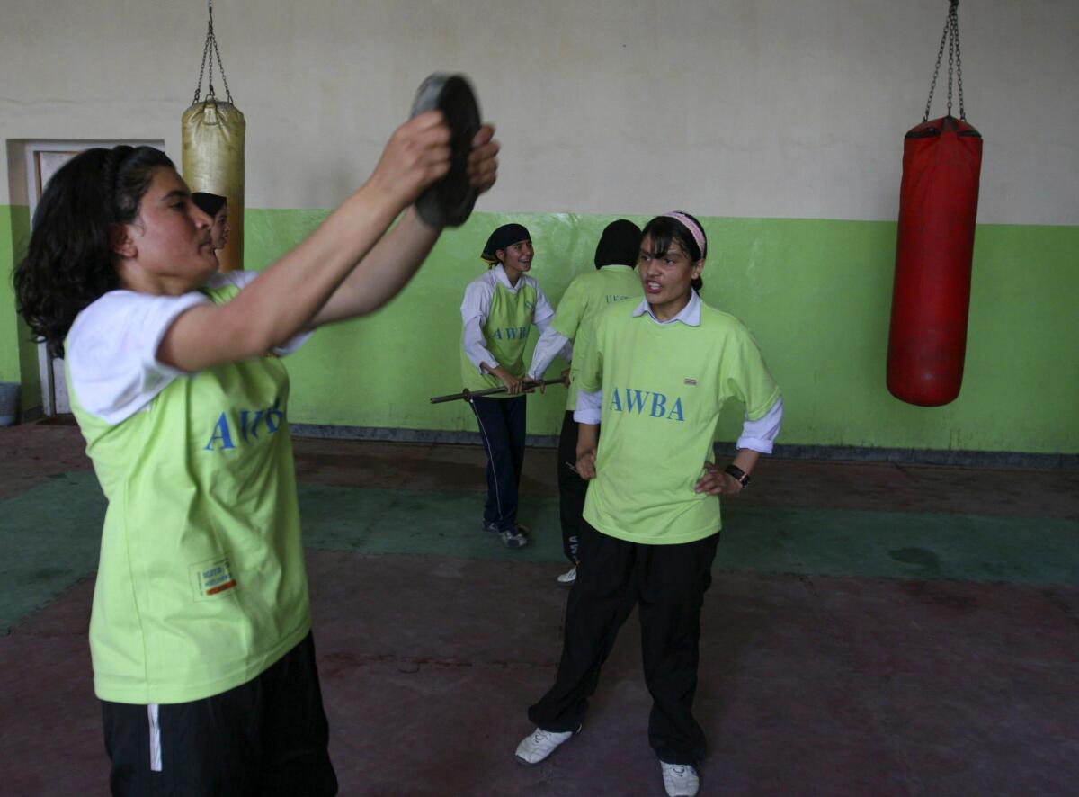Afghan teen girls train in a gym