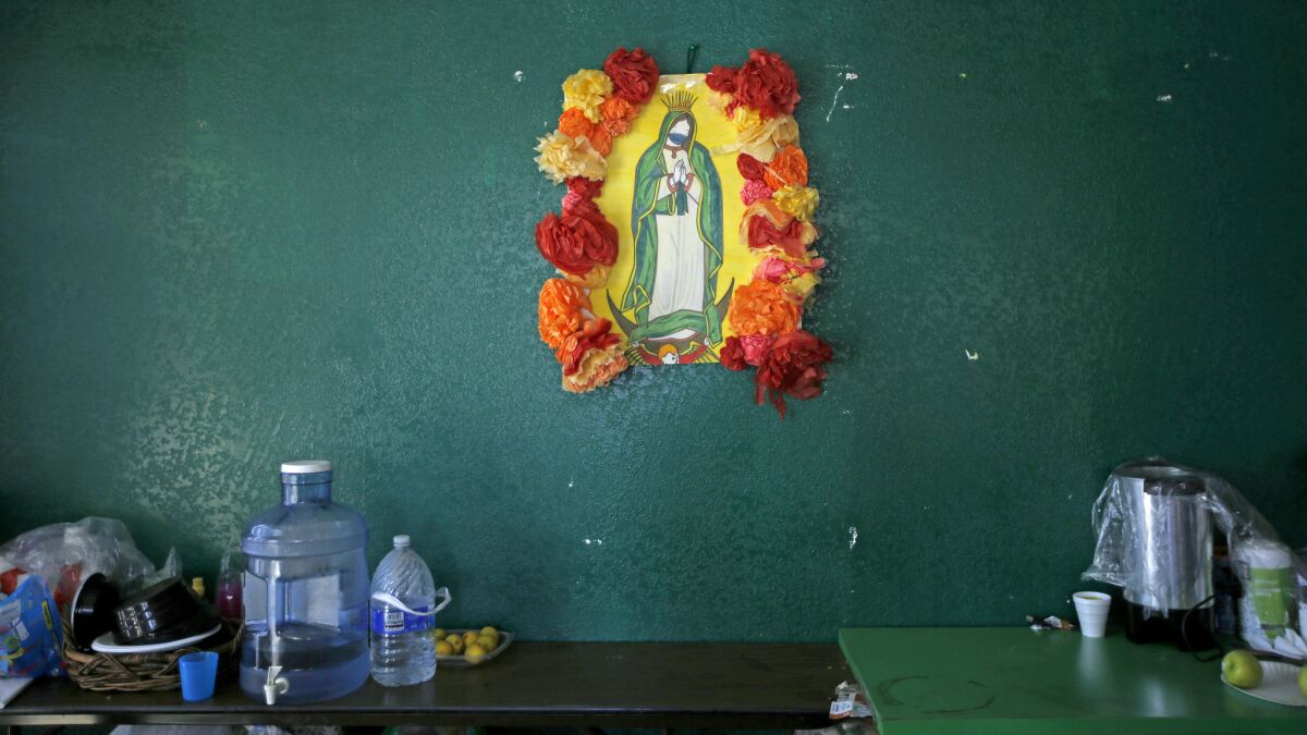 The Virgin Mary in Rivera's office has a mask painted over her mouth.