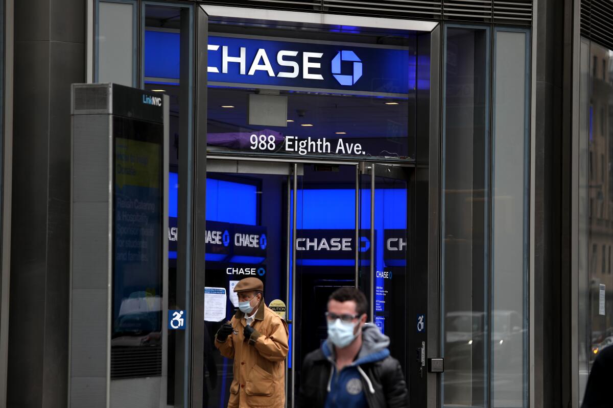 People pass a Chase bank in New York City on April 29.