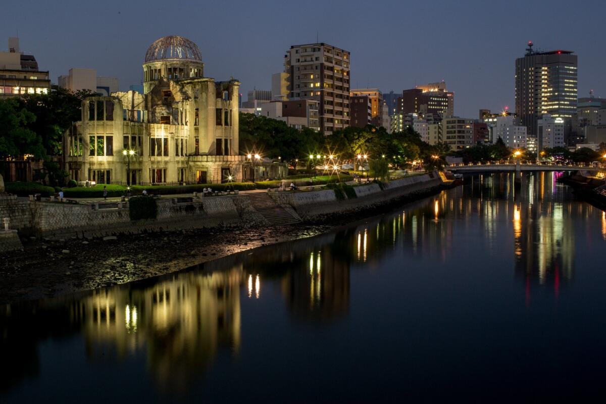 People are seen visiting the Atomic Bomb Dome at the Hiroshima Peace Memorial Park in Hiroshima, Japan on Aug. 5. Japan is preparing to mark the 70th anniversary of the first atomic bomb that was dropped on the nation, on Aug. 6, 1945.