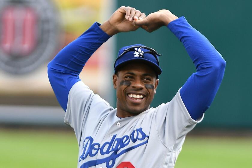 Los Angeles Dodgers Curtis Granderson warms up in the outfield before playing the Detroit Tigers in a baseball game, Saturday, Aug. 19, 2017, in Detroit. Granderson was traded to the Dodgers Friday night. (AP Photo/Lon Horwedel)