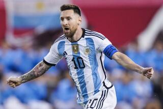 FILE - Argentina's player Lionel Messi celebrates his goal during the second half.