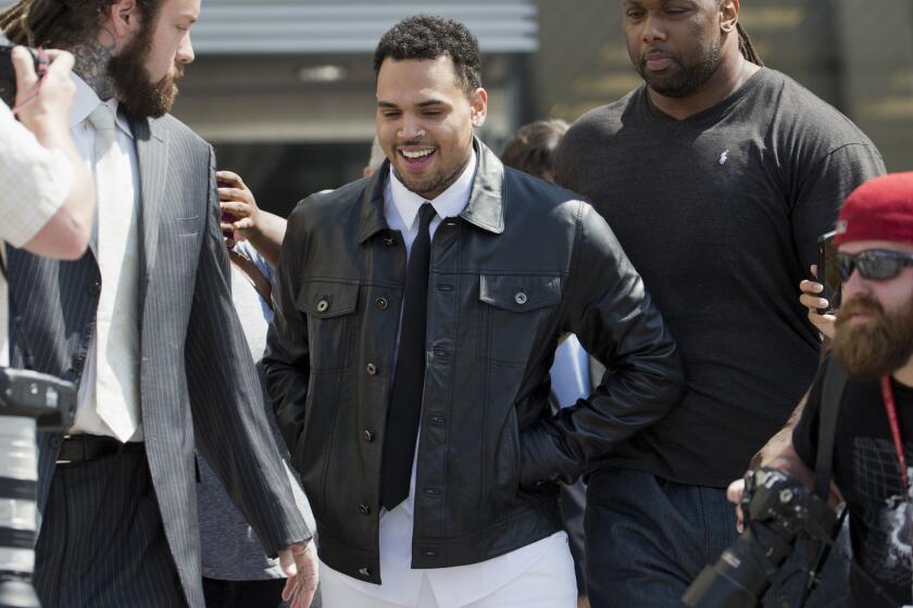 Singer Chris Brown leaves the D.C. Superior Court in Washington on June 25. He is charged with misdemeanor assault.