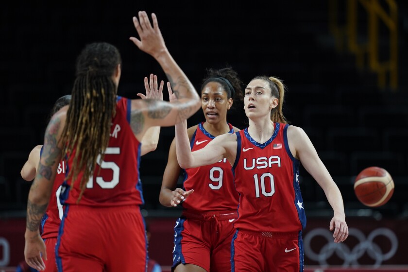 United States's Breanna Stewart (10) high-fives with teammates during a game against Australia at the Tokyo Olympics