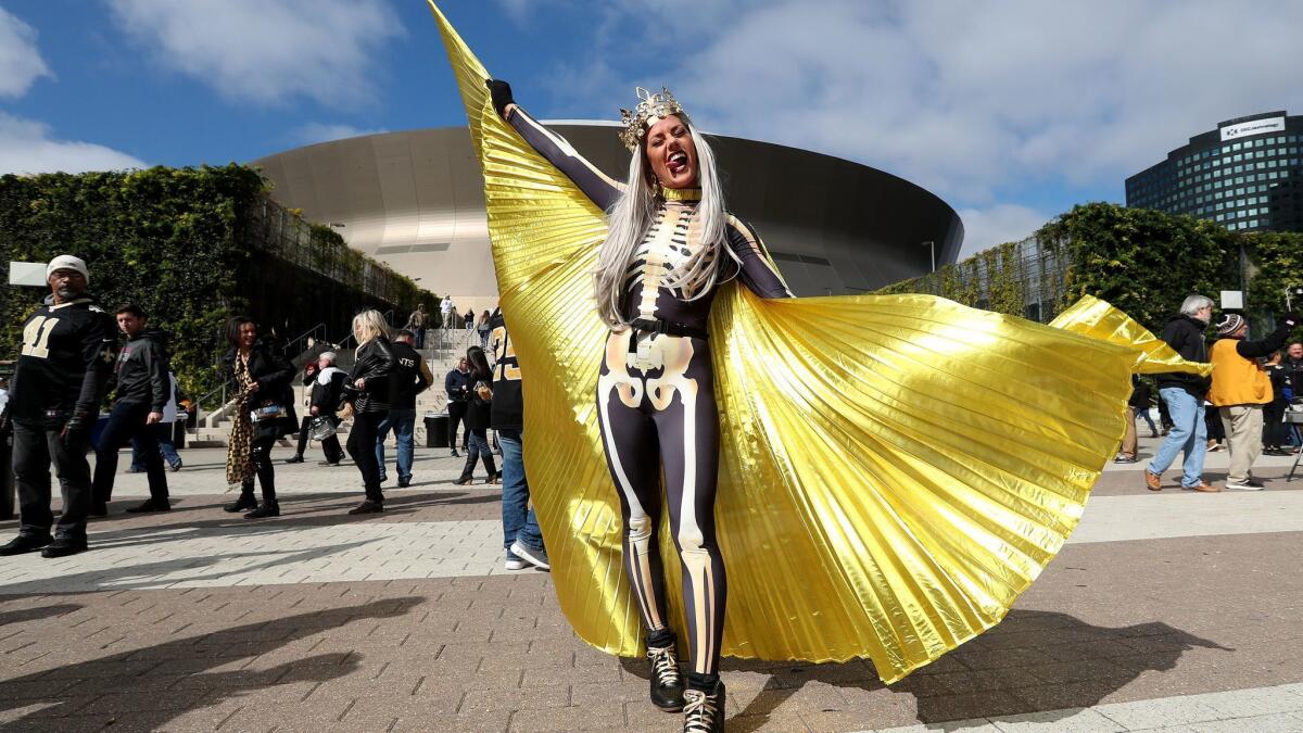 A Saints fan shows her support for the team outside the Superdome on Sunday.