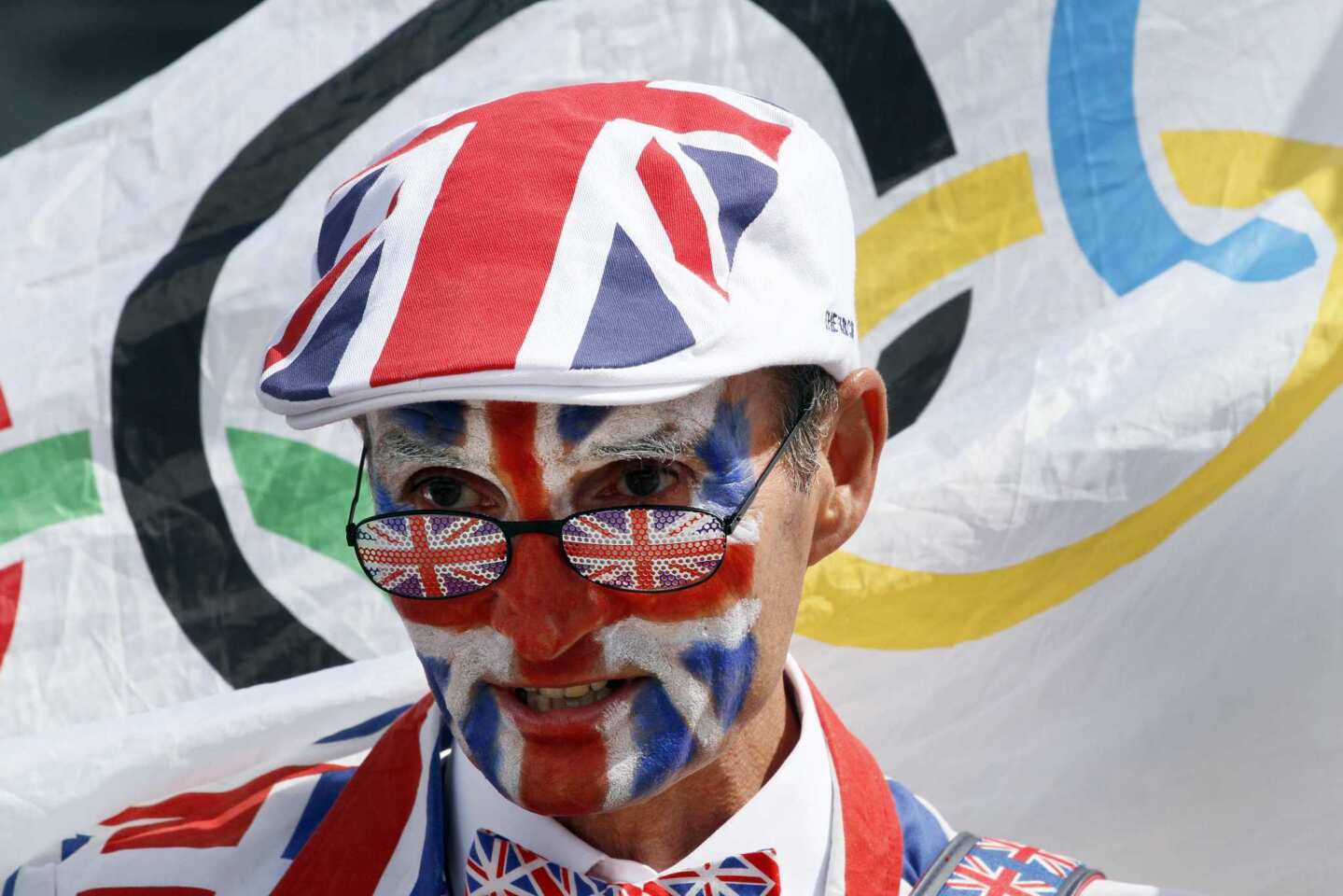 Michael Burn of Watford, England, walks around Olympic Park garbed from head to toe in the Union Jack and carrying an Olympic rings flag. "I'm a passionate spectator," he said. He has tickets to 12 events, including opening and closing ceremonies.