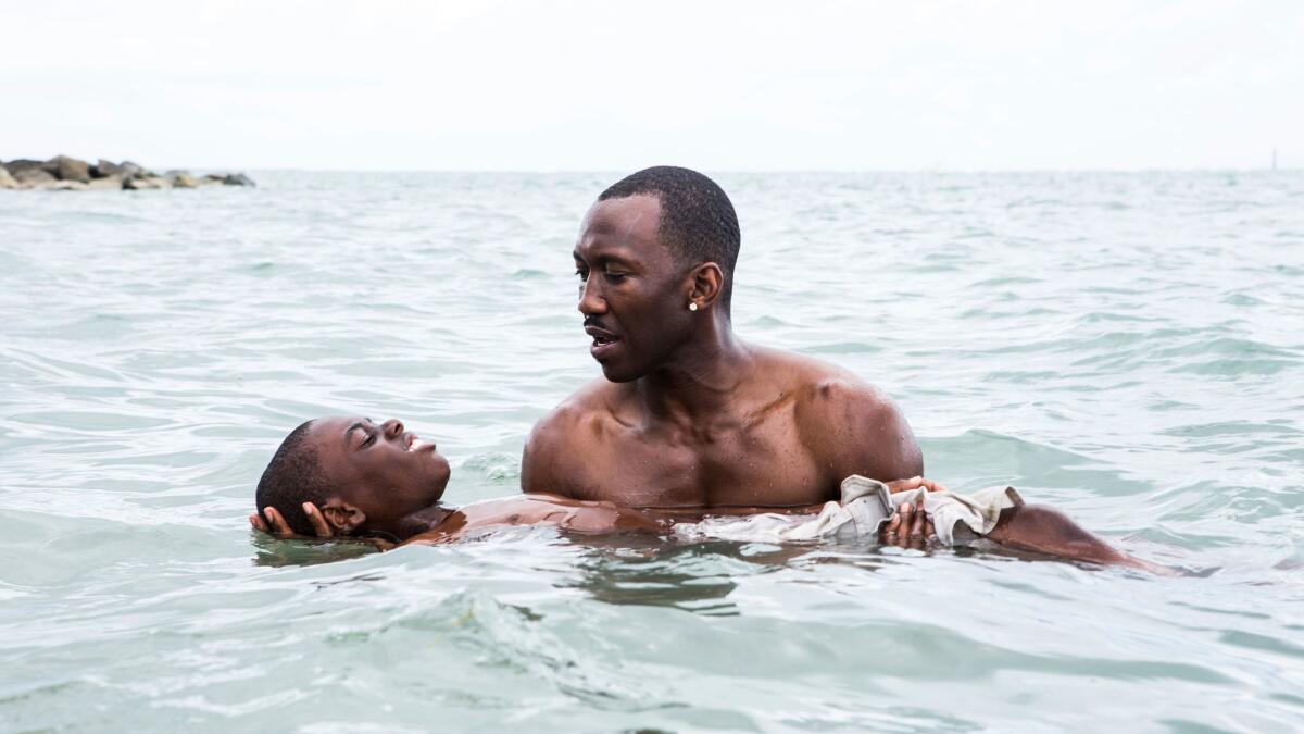 Alex Hibbert and Mahershala Ali in "Moonlight." (David Bornfriend / A24)