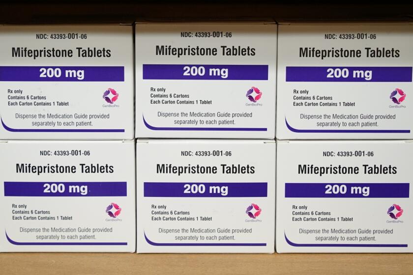 FILE - Boxes of the drug mifepristone sit on a shelf at the West Alabama Women's Center in Tuscaloosa, Ala., on March 16, 2022. A new survey puts a number to how often medical providers in states with laws that seek to protect them from prosecution are prescribing abortion pills to women in states with abortion bans or limits on prescribing the bills by telehealth. (AP Photo/Allen G. Breed, File)