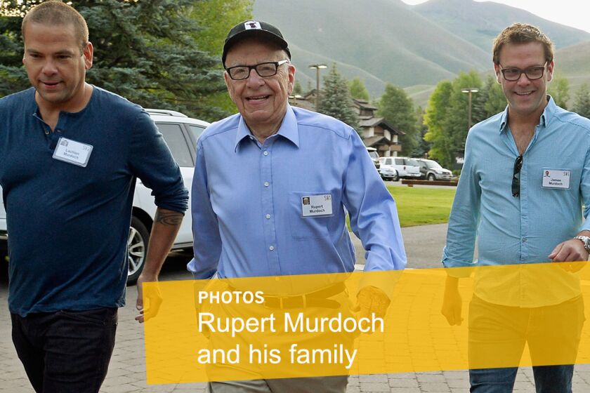 Media mogul Rupert Murdoch, center, appears with his sons Lachlan, left, and James in 2013.